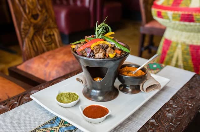 Shekla tibs sizzling in a clay burner